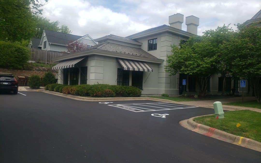 Office building exterior with freshly paved parking lot